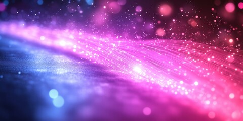 Obraz premium Abstract Background of Glowing Fiber Optics with a Beautiful Gradient of Pink, Blue, and Purple Hues Creating a Magical and Dreamy Atmosphere