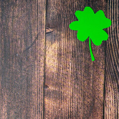 Clover leafs on wooden background, top view, copy space. Concept of luck St. Patrick's Day