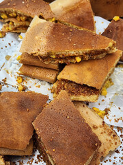 Popular street food. Peanut Pancake Turnover. Made from batter poured onto a very large flat pan, when batter almost cooked, it is then garnished with roasted and chopped peanuts, margarine and sugar
