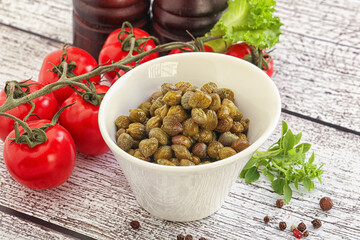 Marinated green capers in the bowl