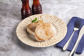 Roasted red tuna steak in the plate
