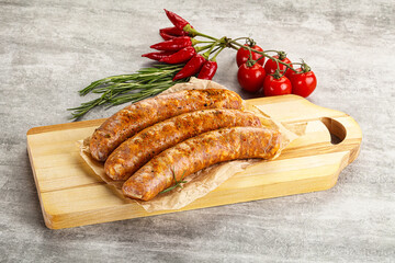Raw sausages with spices and herbs