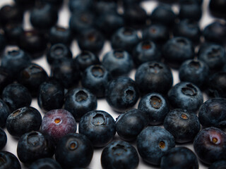 A background image with blueberries in a detailed view and different levels of focus