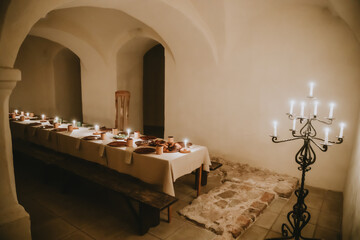 Medieval Banquet Room with Candlelit Long Dining Table