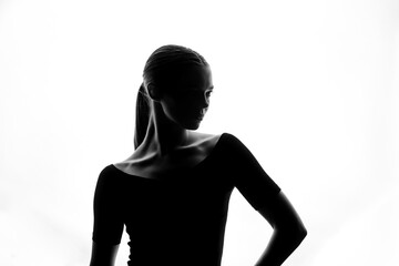 Fototapeta premium Graceful Silhouette of Woman in Elegant Side Profile