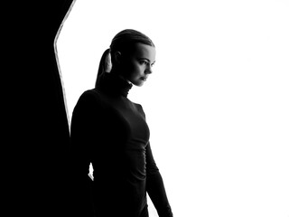 Silhouette of Woman Posing Elegantly in Studio Lighting