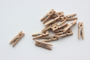 Isolated wooden clothes pegs, stationery and photo, wooden pegs on white background