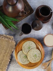 Serabi is a traditional dessert from Indonesia served with coconut milk
