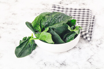 Ripe green spinach leaves heap