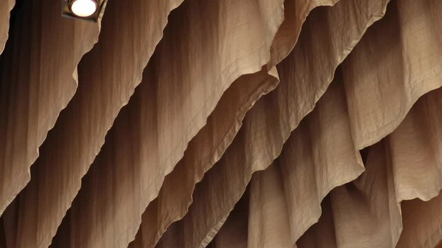 A ceiling with fabric waves. 