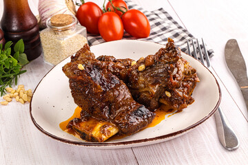 Prepared tasty beef ribs with sauce