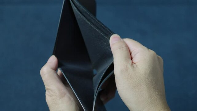 Businessman is revealing an empty wallet