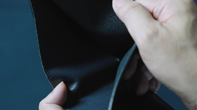 Businessman is sadly opening his empty wallet, revealing he has no money