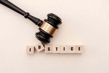 Gavel and JUSTICE Letter Blocks on Neutral Background