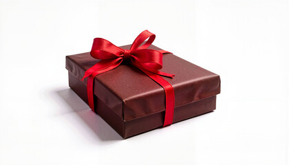 Obraz premium Gift box of chocolate candies tied with a red ribbon on a white background