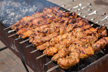 Tasty pork is cooked on the grill
