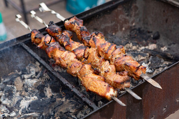 Tasty pork is cooked on the grill
