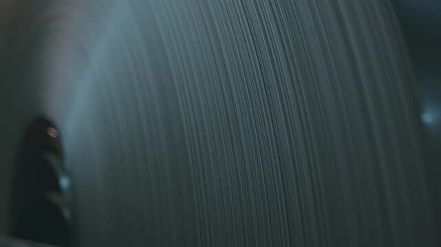 Close-up of a sheet aluminum rolls in the factory warehouse. Paper in the reel.