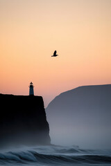 A tranquil scene capturing the silhouette of a solitary lighthouse on a cliff with a lone bird soaring above, set against a vibrant sunset sky over the ocean waves.