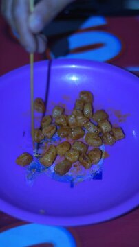 Cimol or Starch Balls are a typical Indonesian snack served on a plate.