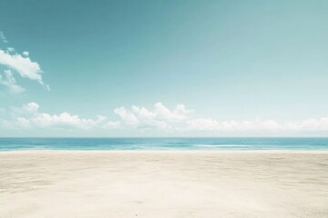 Obraz premium Serene Beachscape: Tranquil Ocean and Sandy Shores Under a Blue Sky