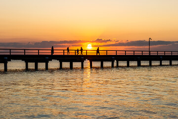 Jetty pier at sunset, Fraser Island K'gari, Queensland Australia, summer weekend coastal lifestyle...