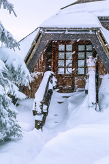 Fototapeta premium House entrance with heavy snow during snowfall