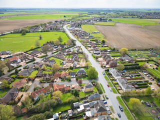 Drone high altitude view of a typical British sprawling village in Cambridgeshire, UK. Showing a...