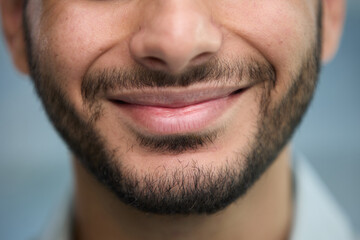 Obraz premium young beautiful man with brown eyes looks at the camera.