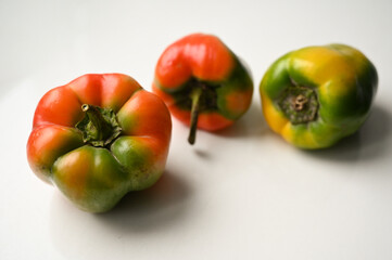 
peppers on a white table