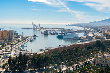 Naklejka premium Malaga city and port, Andalucia, Costa del sol, Spain. Cruise ship, cranes, lighthouse. Málaga bay and harbour