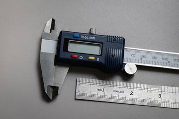 Digital Caliper and Stainless steel ruler for quality assurance, engineering design, mechanical design tools. Ruler with imperial markings.