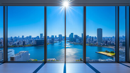 窓越しに広がる初夏の東京湾と青空のビル景観