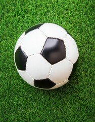 Fototapeta premium Vivid green grass texture ideal for sports events, featuring a classic black and white soccer ball, suitable for football games on vibrant turf