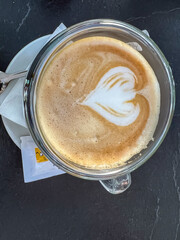 Coffee with milk with a heart made of foam