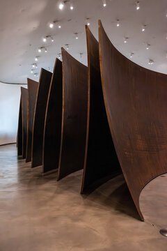 Bilbao, Spain - Mai 16, 2024 - Giant steel sculpture The Matter Of Time, designed by artist Richard Serra and exhibited in the Guggenheim Museum in Bilbao