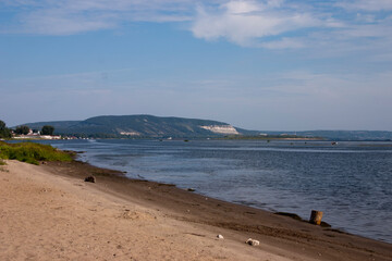View of the coast of the Volga River from the sandy beach.
