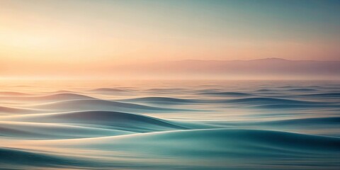 Fototapeta premium Serene and Ethereal Landscape of Rolling Dunes with a Misty Horizon at Dawn