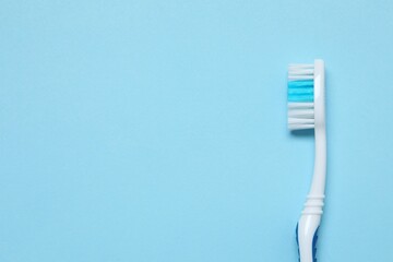 Toothbrush on a colored background. Concept of tooth treatment and dental care