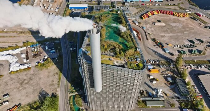 Aerial drone view of CopenHill artificial ski slope on the roof of an energy plant