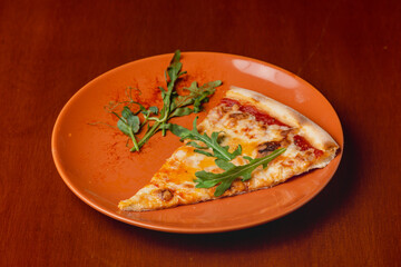 Slice of Italian pizza four cheeses on plate on wooden background