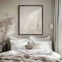 A framed picture of a white bed with pillows and a blanket