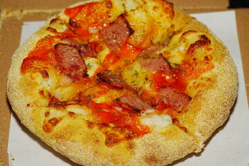 Pizza is a popular Italian dish that has become a global favorite. It's made by baking a round, flat base of dough topped with various ingredients such as cheese, tomato sauce