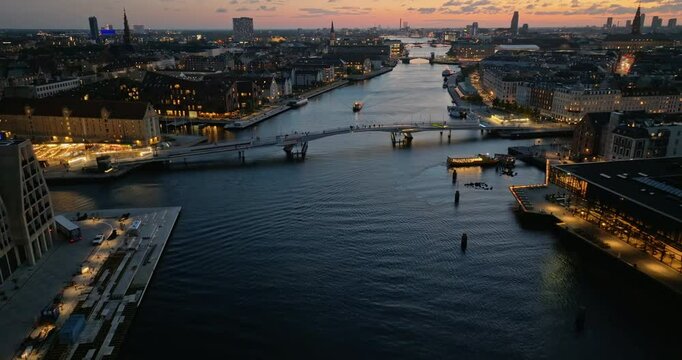 Aerial drone view of Knippel bascule bridge in Copenhagen, Denmark at night