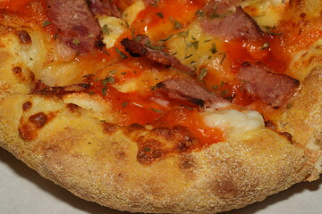 Pizza is a popular Italian dish that has become a global favorite. It's made by baking a round, flat base of dough topped with various ingredients such as cheese, tomato sauce
