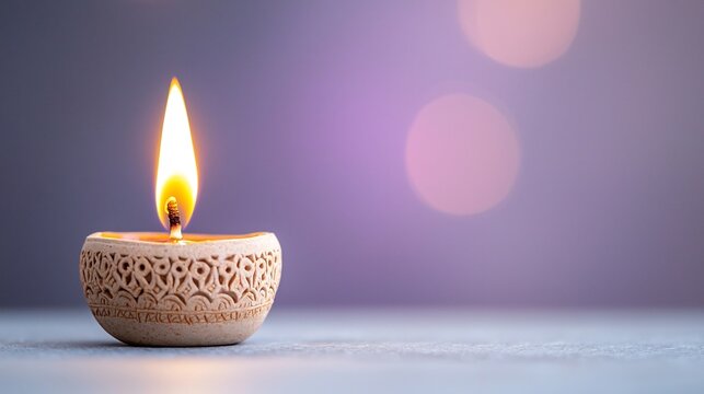 Closeup of a beautifully crafted Diwali oil lamp with intricate clay design its warm flames illuminating against a soft blurred purple bokeh background for the Hindu festival of lights