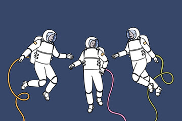 Group of astronauts participating in space research mission floats in zero gravity, dressed in spacesuits. Teamwork of astronauts going on scientific expedition in orbit of planet or in galaxy