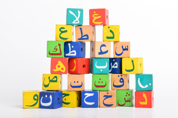 Wooden Arabic Alphabet Blocks isolated on white background. Arabic Alphabet Cubes. Preschool and...