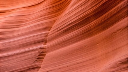 Obraz premium Abstract view of orange slot canyon wall in Antelope Canyon X,Vibrant orange hues of Antelope Canyon X's slot canyon wall,Arizona, USA