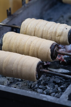Cooking sweet buns on a spit